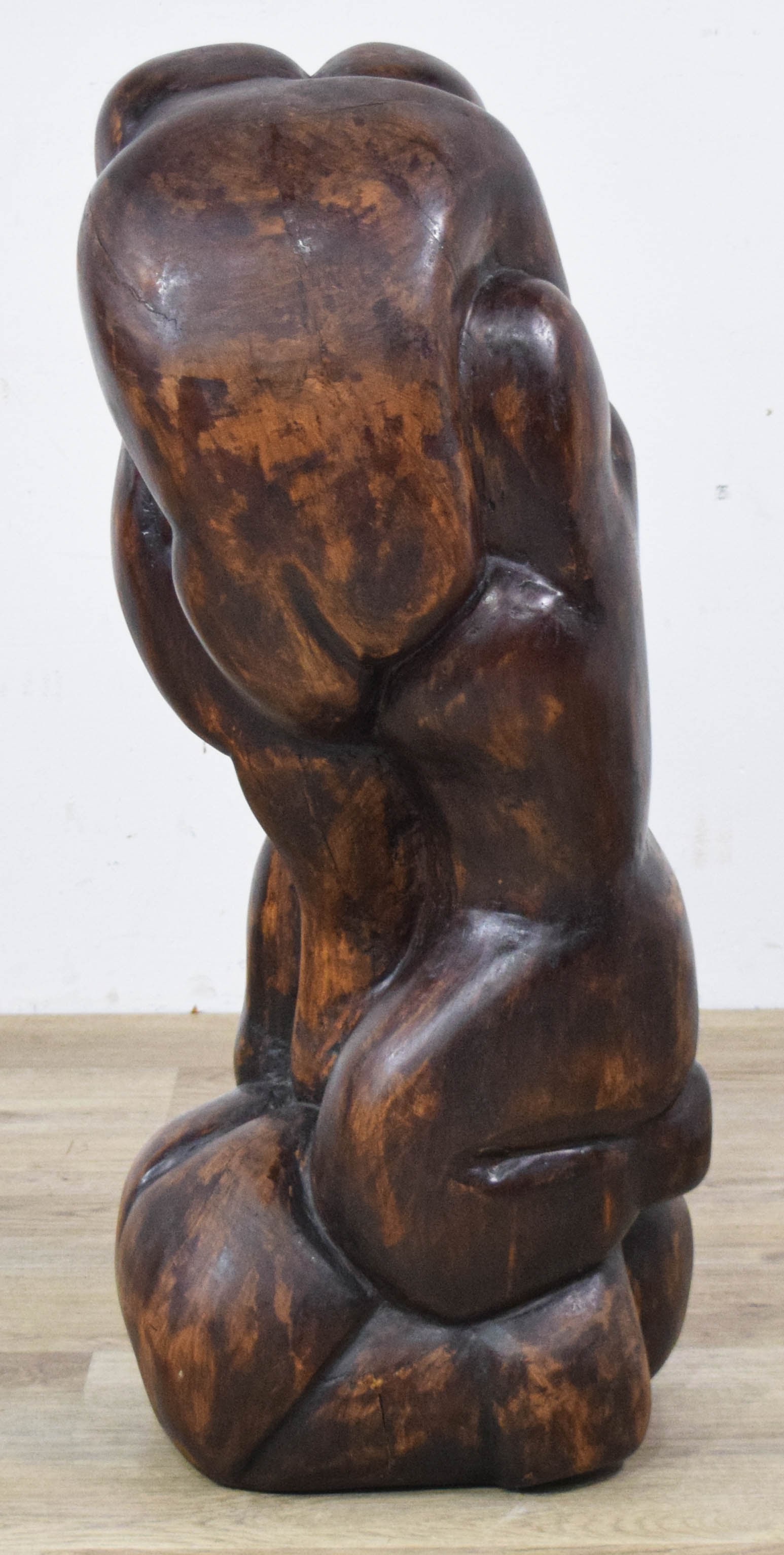 Ben Goodkin Carved Wood Abstract Figurative Sculpture: Ben Goodkin (American, 20th Century). Large carved wood figurative sculpture featuring abstract bulbous human forms depicted in various intertwined poses. The piece is finished in a dark stain that hi