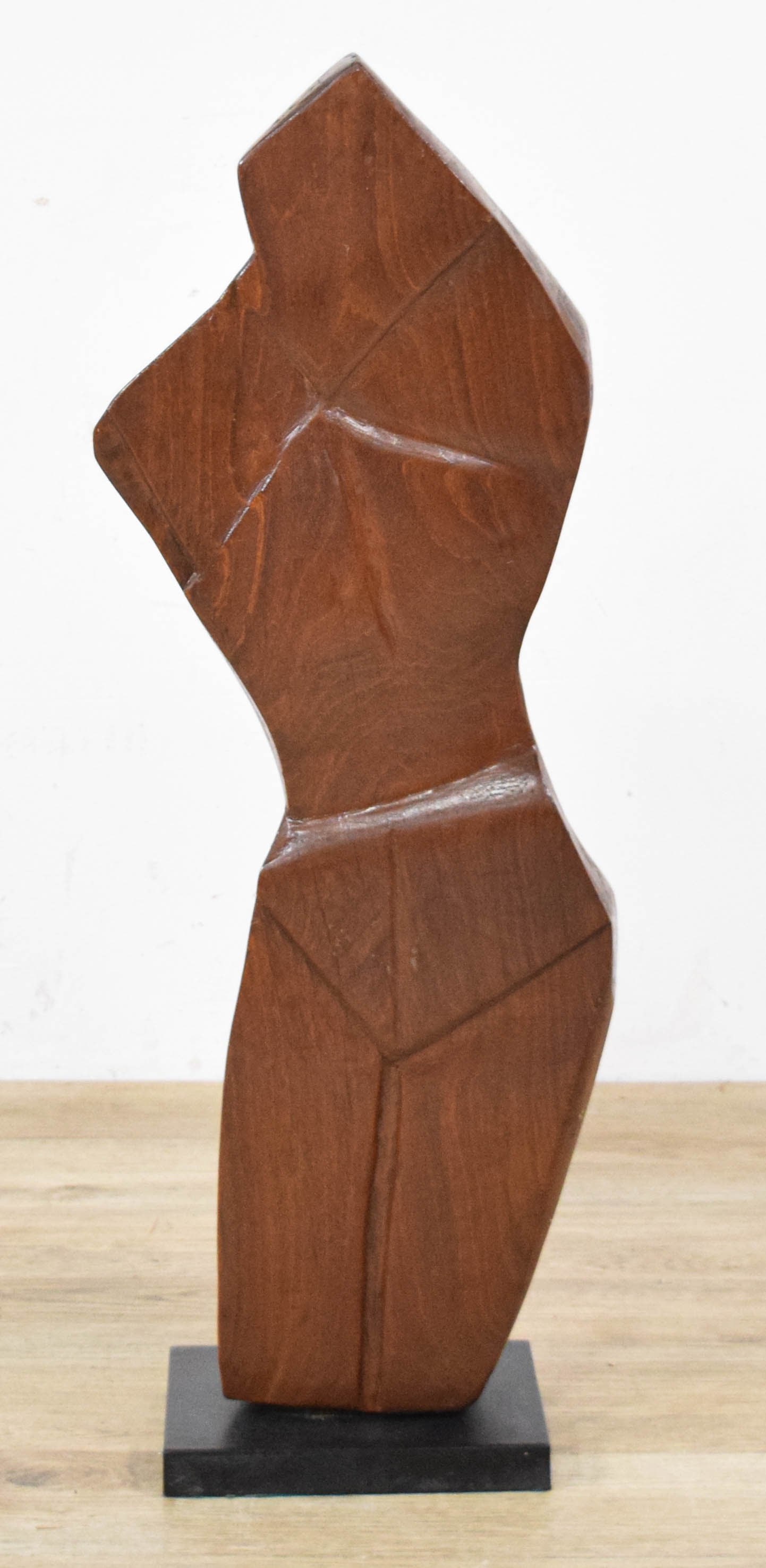 Ben Goodkin Carved Wood Abstract Female Torso Sculpture: Ben Goodkin (American, 20th Century). Mid-Century Modern carved wood sculpture depicting an abstracted female torso, characterized by stylized, angular planes and deep geometric incised lines. Finishe