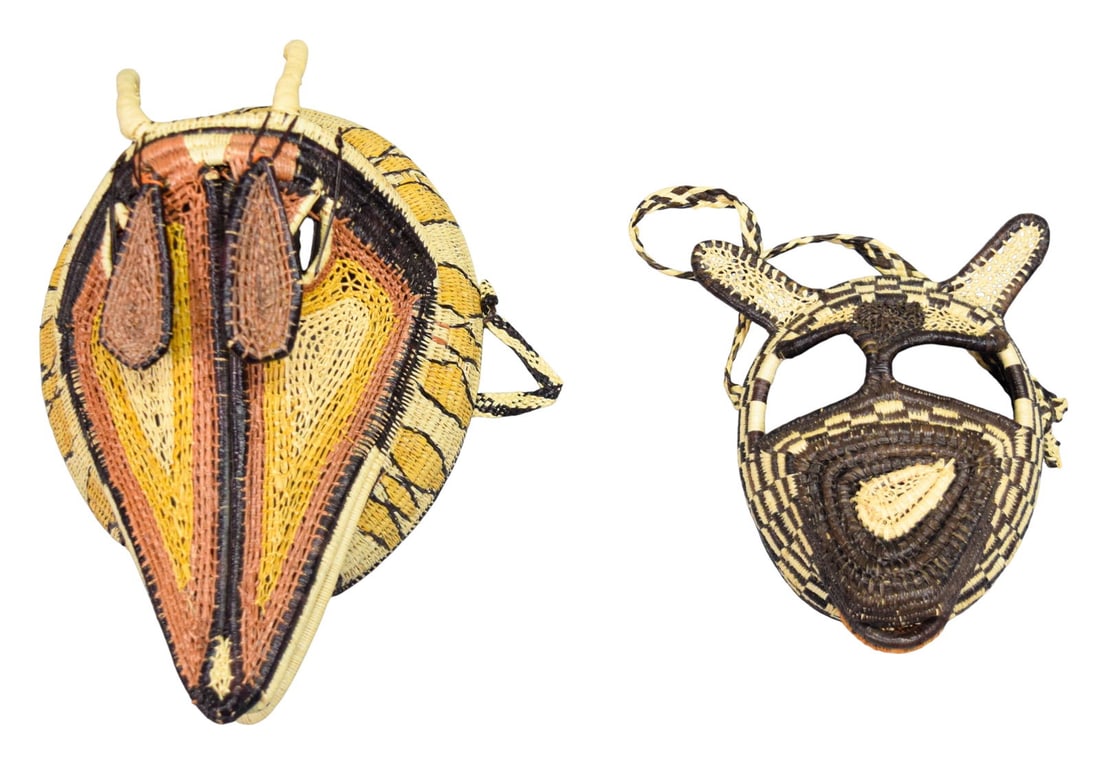 2 Woven Animal Masks Ember?? Panama: Two Embera-Wounaan Panamanian woven fiber masks. Largest 12" L x 8 1/2" W x 6" D. Well-preserved natural pigments with very minor fading.