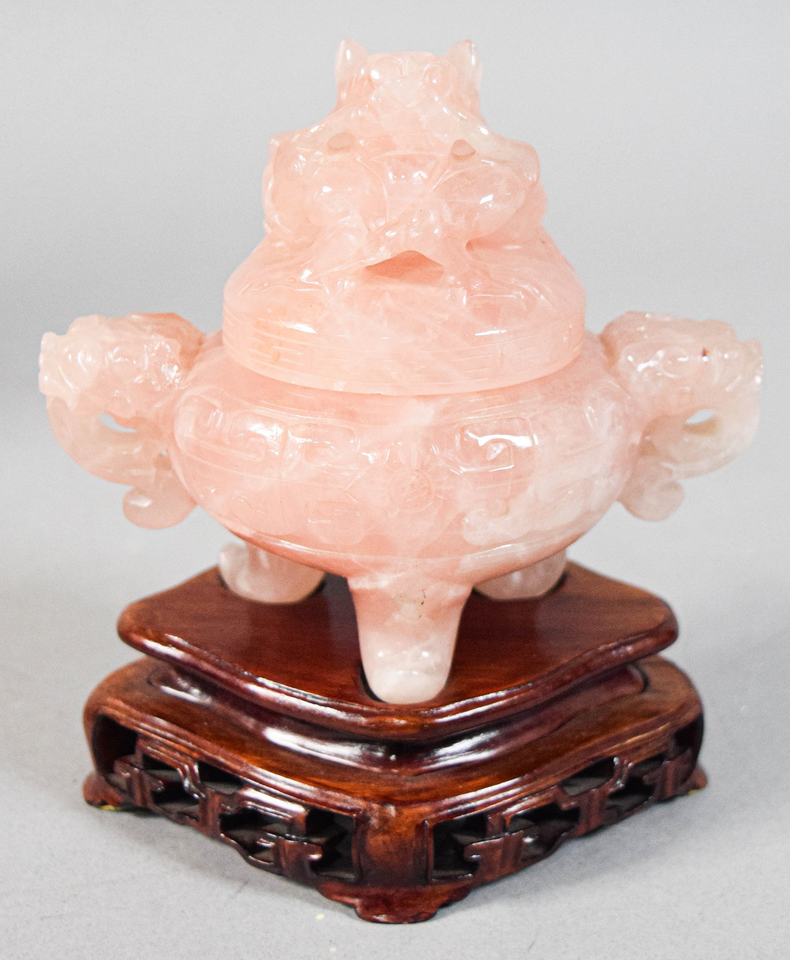 Chinese Carved Rose Quartz Tripod Censer and Stand with Presentation Box: Chinese carved rose quartz tripod censer with a matching cover and stand. Body of the vessel flanked by two handles carved in the form of dragon heads and rests on three lion-mask tripod feet. Domed l