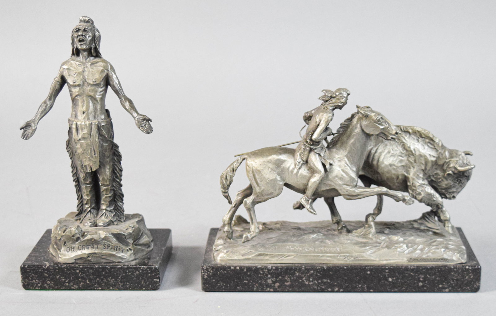 Two Philip Kraczkowski Native American Sculptures 1971-1972: Philip Kraczkowski (American, 1916-1996). Two pewter sculptures on stone bases, Oh Great Spirit and Buffalo Hunt. Both signed and dated on the bases. Oh Great Spirit sculpture marked Manchester Pewter