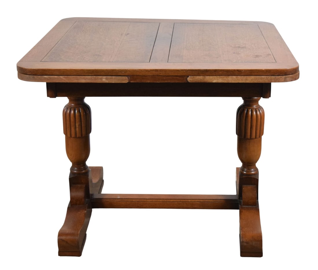 Oak Draw Leaf Pub Table: Oak draw leaf pub or dining table. Sliding pull-out leaves on either side. Unsigned. 20 3/8"H x 36 3/8"L x 35 3/8"W closed, 60 5/8"L open with leaves. Repaired section on top of on