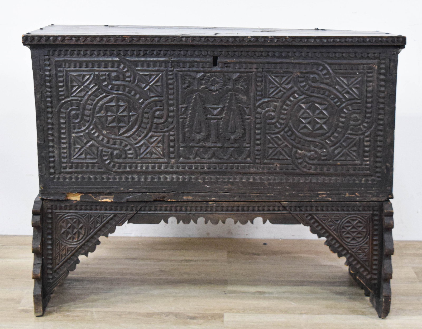 19th Century Carved Moorish Blanket Chest: 19th century carved wooden Moorish blanket chest. Elevated on trestle-style supports. Interior with small wooden side till. 32" H x 41 1/4" W x 17" D.