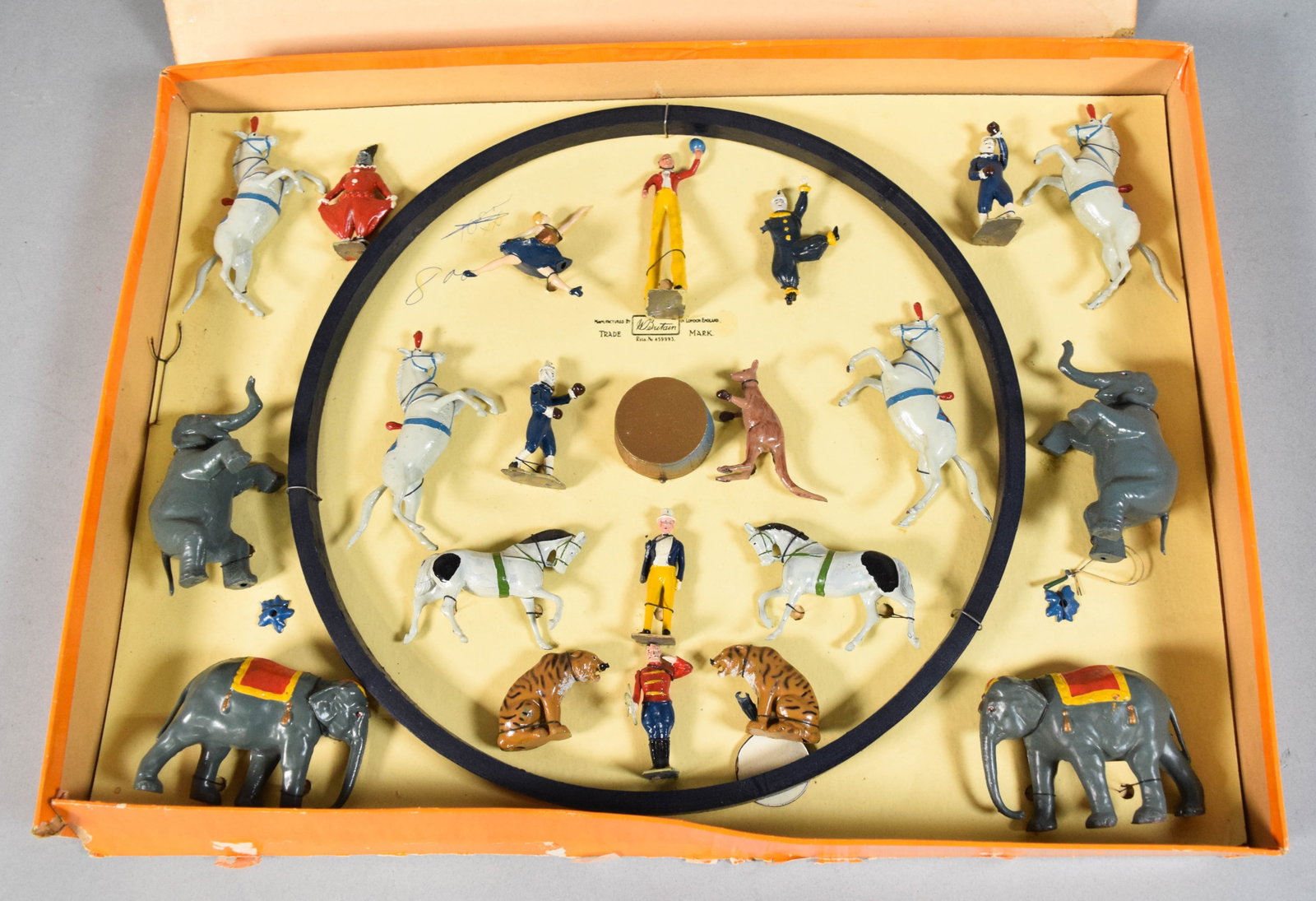 Britain's Mammoth Circus Boxed Set by W. Britain: Britain's Mammoth Circus boxed set manufactured by W. Britain of London, England. The collection contains an assortment of hand-painted metal figures depicting various circus performers and animals. P