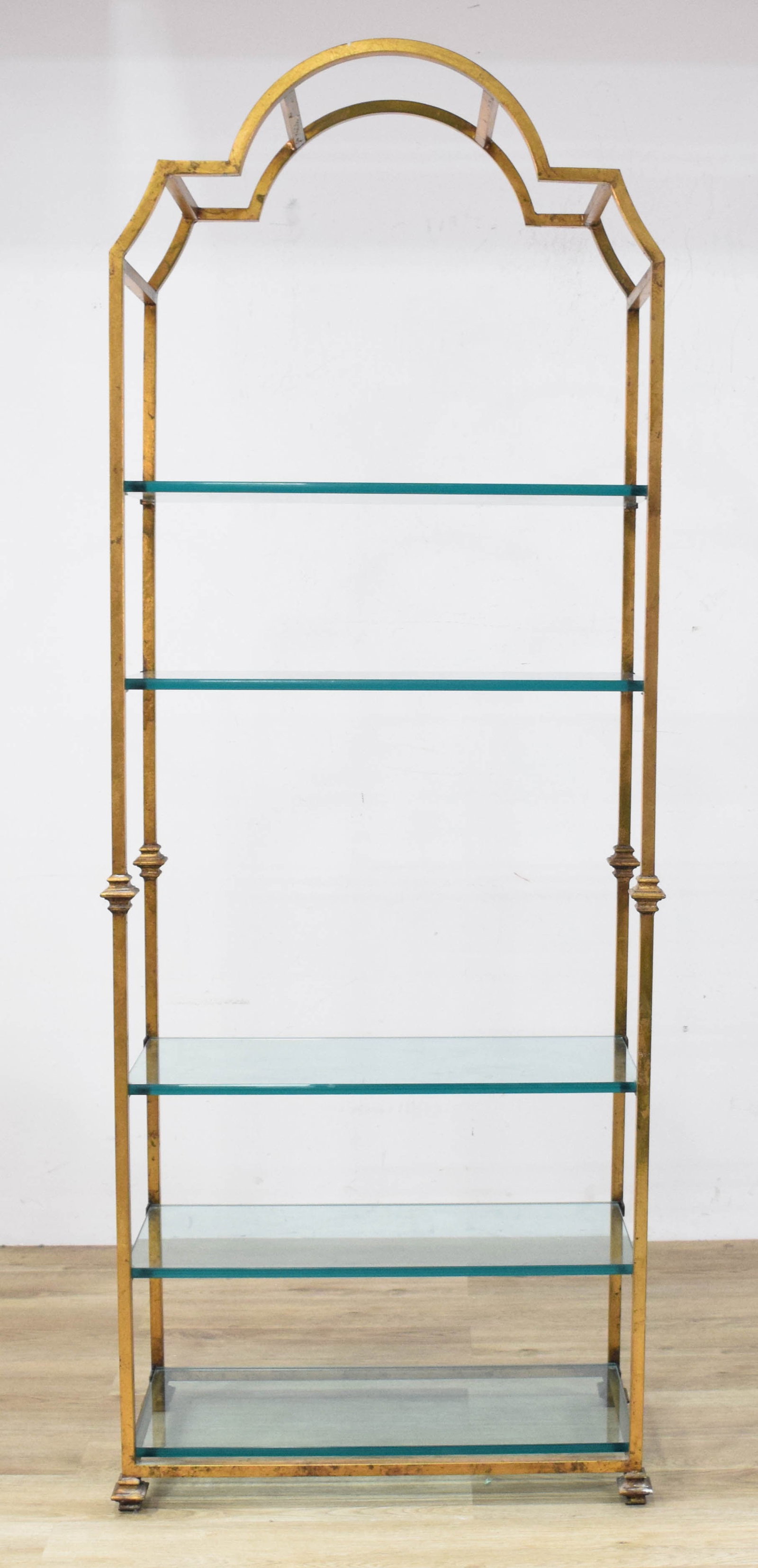 Hollywood Regency Style Gilt Metal and Glass Etagere: Hollywood Regency style gilt metal five-tier etagere, late 20th century. 62 1/2" H x 30" W x 14" D.