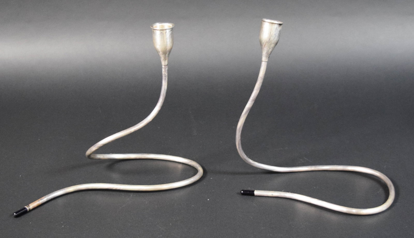 Pair of Marion Noyes for Towle Weighted Sterling Candlesticks: Pair of Marion Noyes for Towle weighted sterling silver serpentine candlesticks. Each interior candle cup stamped Towle Sterling Weighted Reinforced. 528 grams total. Each 8 1/2" H.