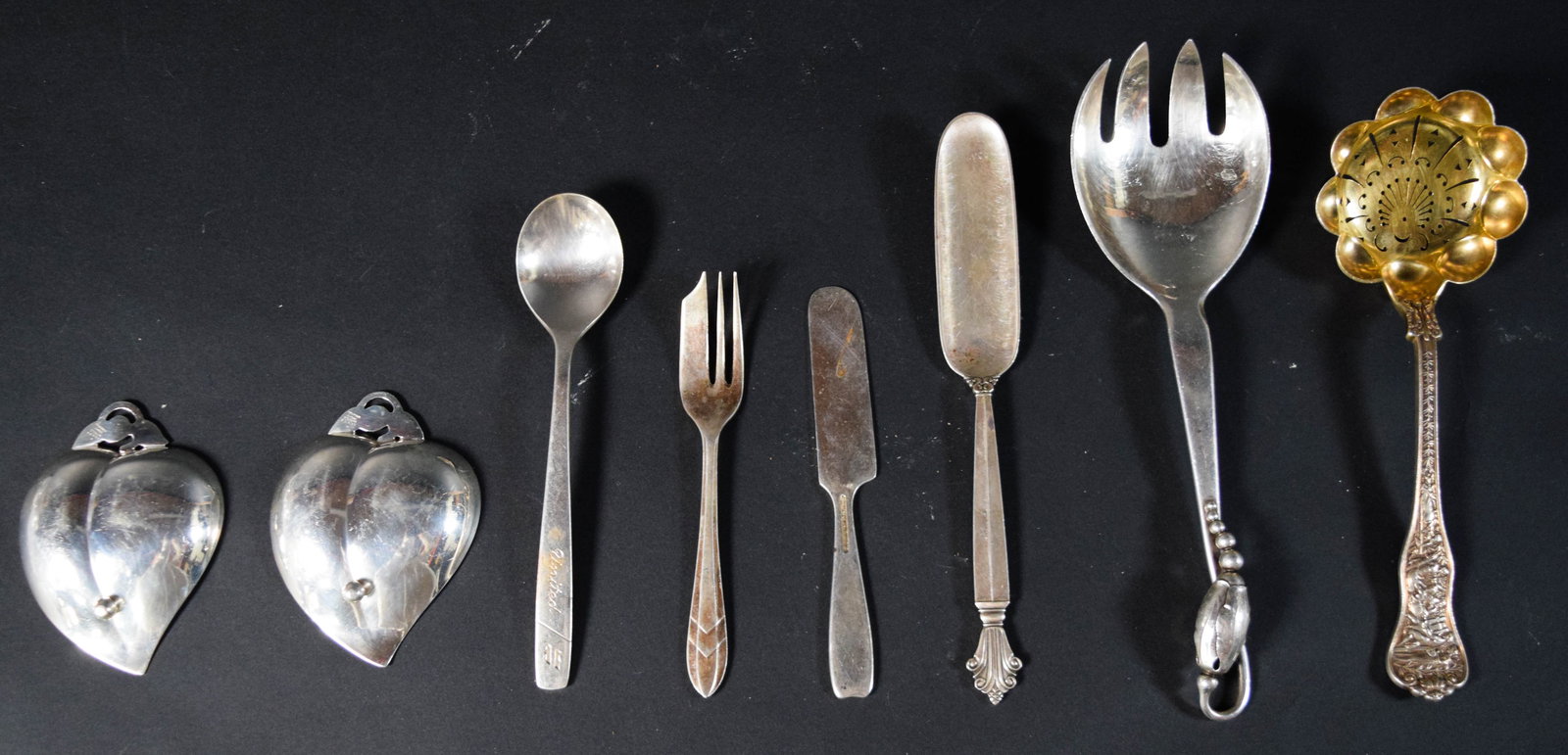 8 Sterling and Silver-Plated Serving Pieces Incl Tiffany and Co.: Group of eight sterling silver and silver-plated flatware and serving pieces. One pair of Tiffany and Co. sterling silver heart-shaped nut dishes with leaf and berry handles, stamped with pattern numb