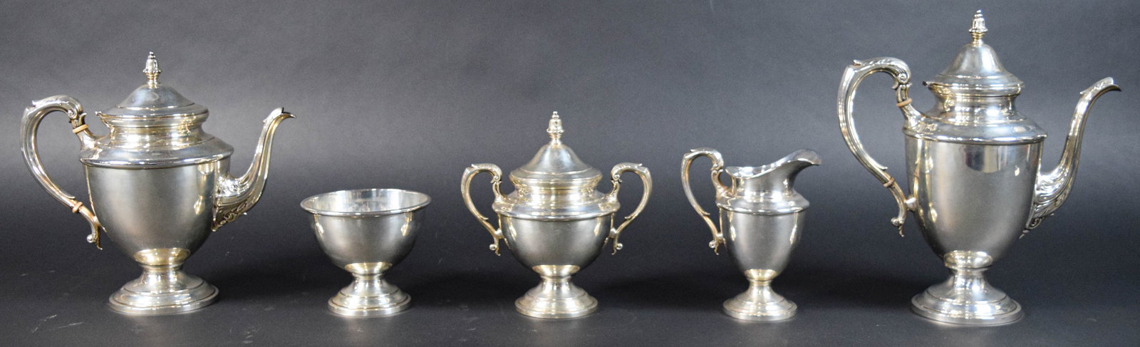 Mauser Sterling Silver 5 Piece Tea and Coffee Service: Mauser Manufacturing Co. sterling silver five-piece tea and coffee service, including a coffee pot, teapot, covered sugar bowl, creamer, and waste bowl. Marks on the underside include M, Sterling, and