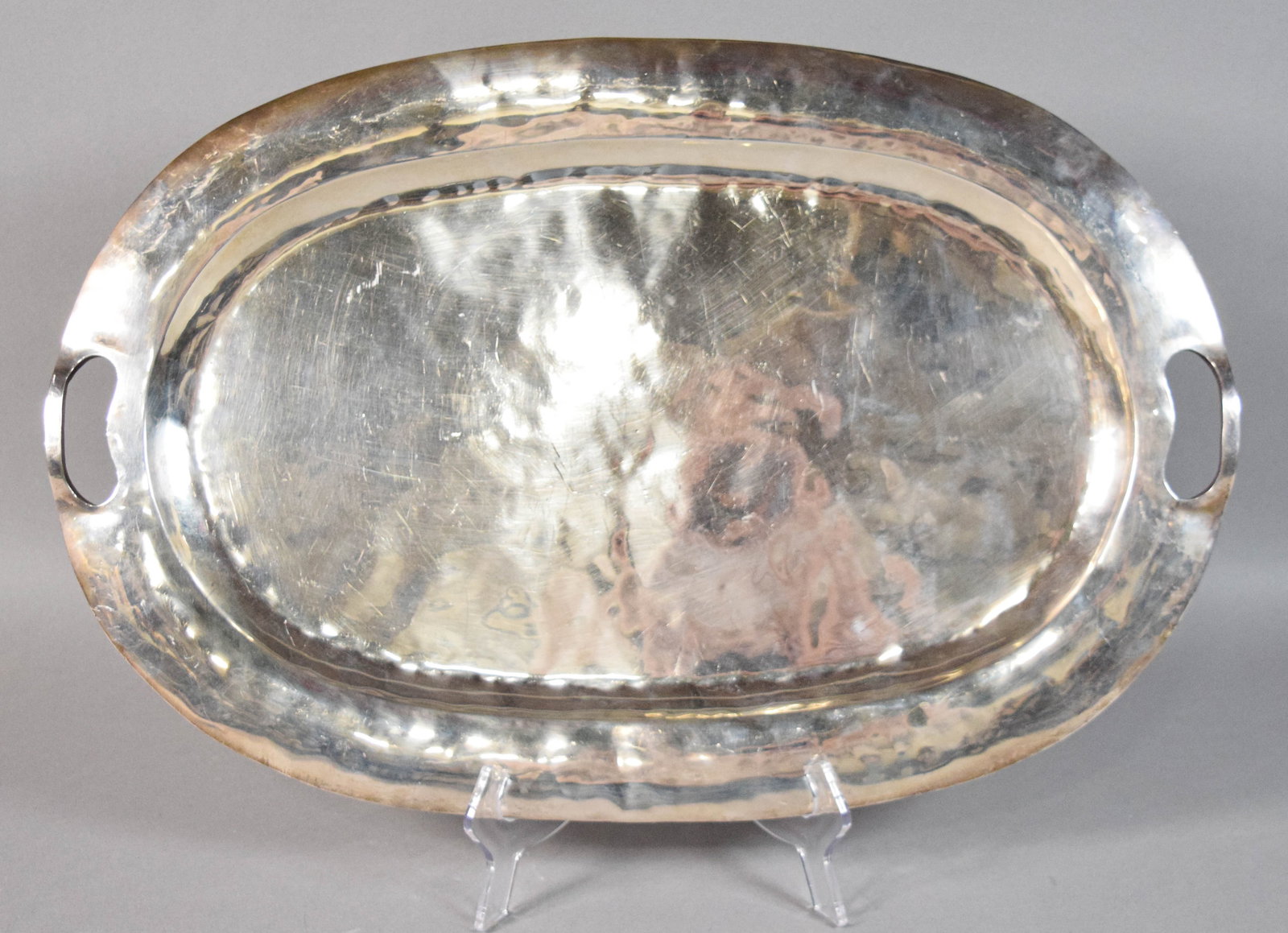 Mexican Sterling Silver Hammered Oval Serving Tray: Mexican sterling silver hammered oval serving tray. Underside stamped Plata 925, Mexico Lindo. 2,002 grams. 23 1/2" L x 15 1/2" W.