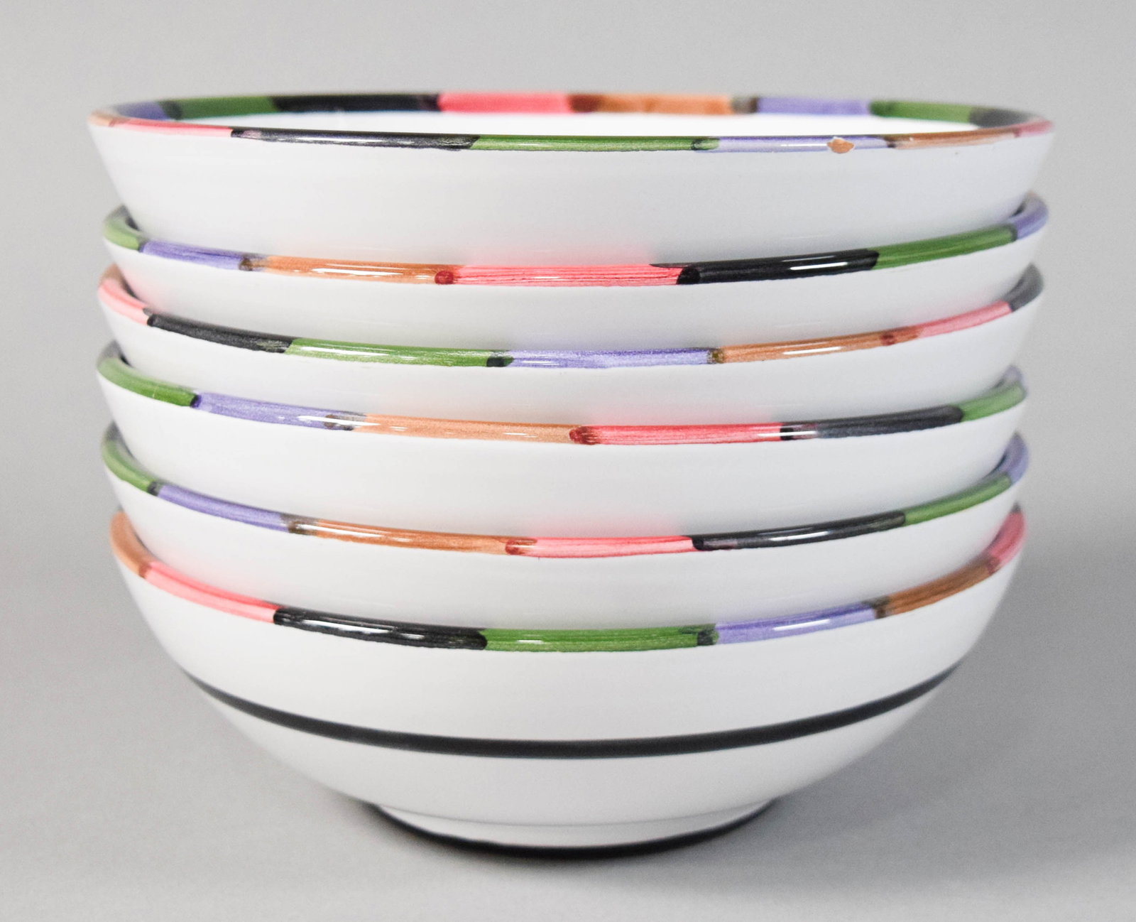 Set of 6 Deruta of Italy Ceramic Bowls: Set of six Deruta hand-painted ceramic bowls with white glazed bodies in the Circo pattern. Marked on the underside Circo, B. Goldsmith Design, Deruta of Italy. 2 1/2" H x 8 1/4" diameter.