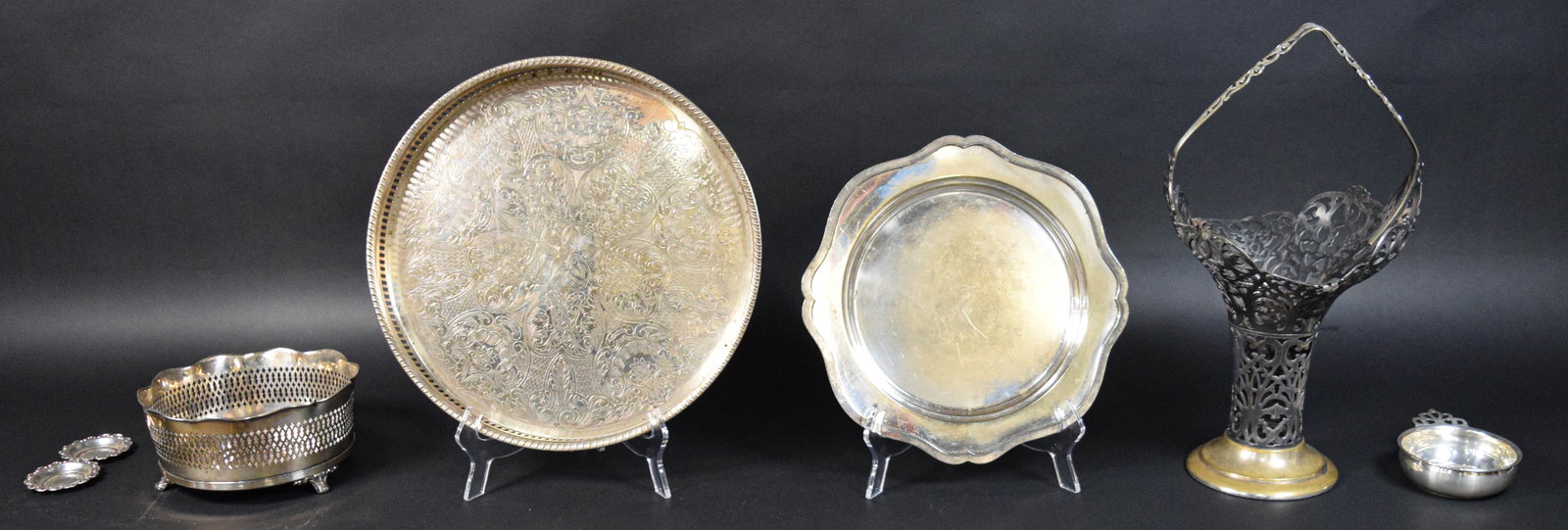 6 Silver and Silver-Plated Tableware Items: Group of six silver and silver-plated tableware items from various American and Canadian makers. Includes one small sterling porringer marked Web Sterling on the underside; one tall silver-plated pier