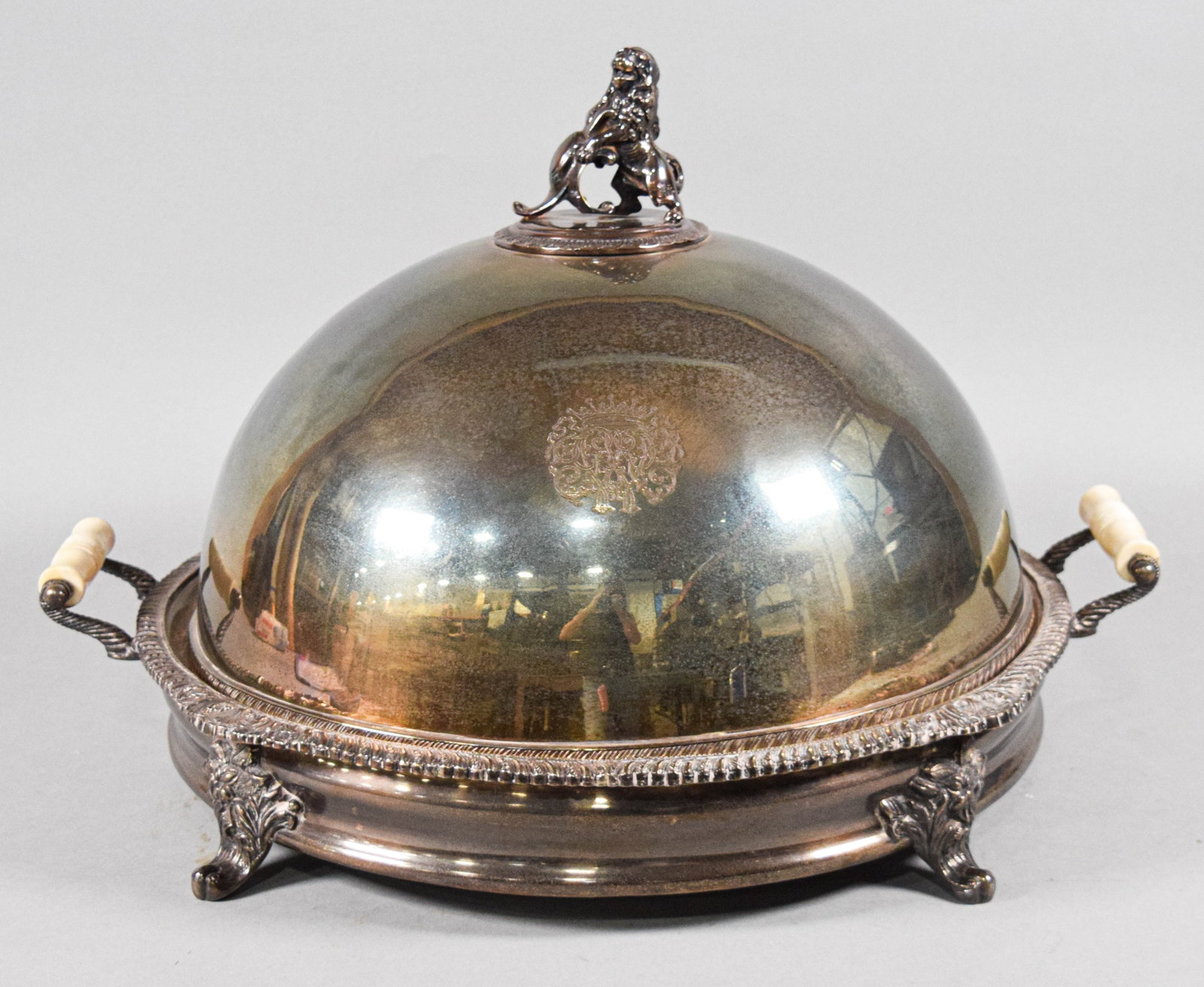 Georgian Style Silver Plated Serving Dish and Cover, Joe Hirsch Turf Classic Trophy: This silver-plated serving dish and cover is designed in the Georgian style and features a high-domed lid surmounted by a figural lion finial. The exterior of the lid is decorated with an engraved arm