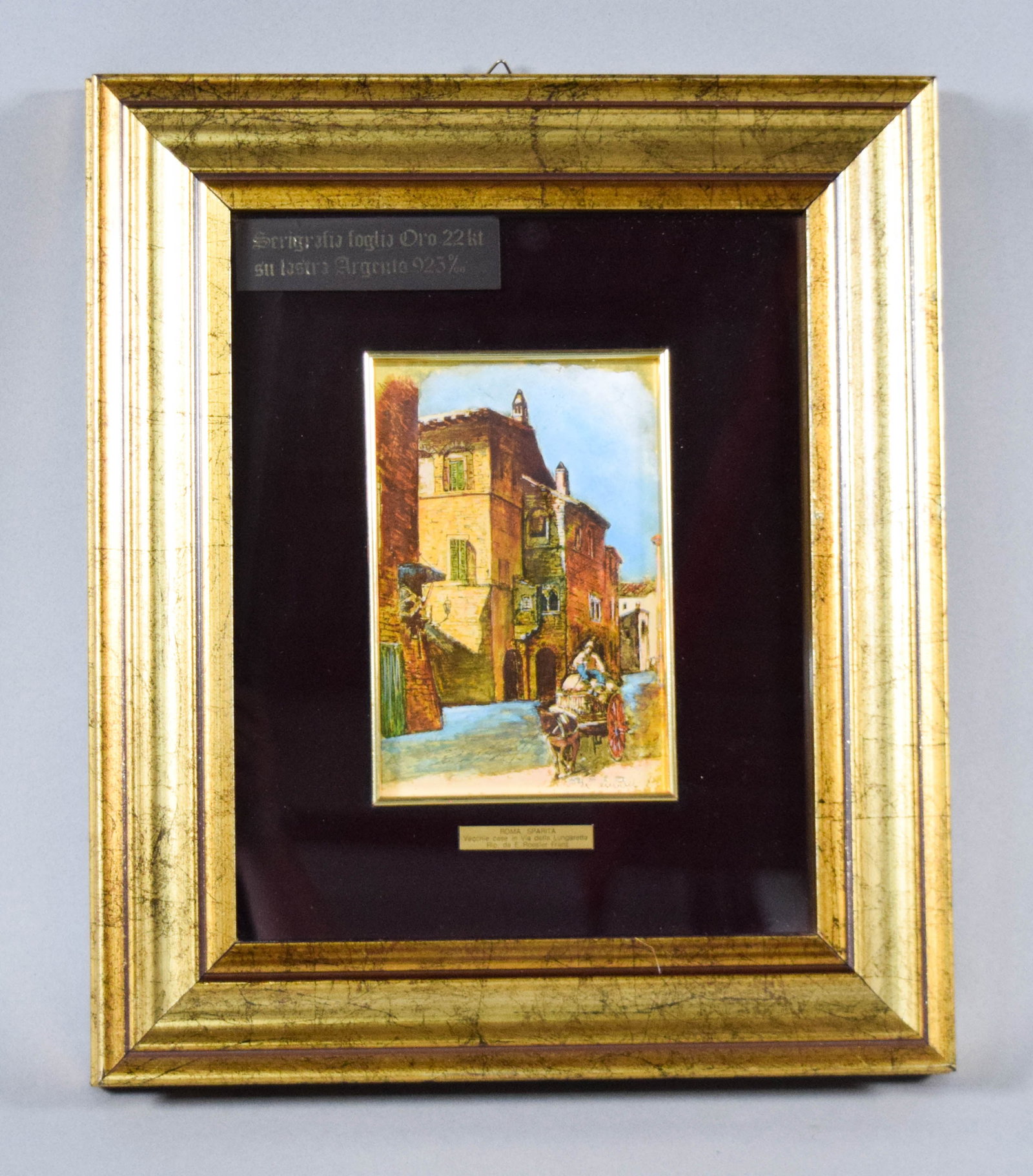 Ettore Roesler Franz (After), Roma Sparita Serigraph on 22kt Gold Leaf and .925 Silver Plate: This multi-color serigraph is executed on a ground of 22 karat gold leaf applied to a .925 sterling silver plate. The work depicts a historic street scene from the Roma Sparita (Vanished Rome) series 