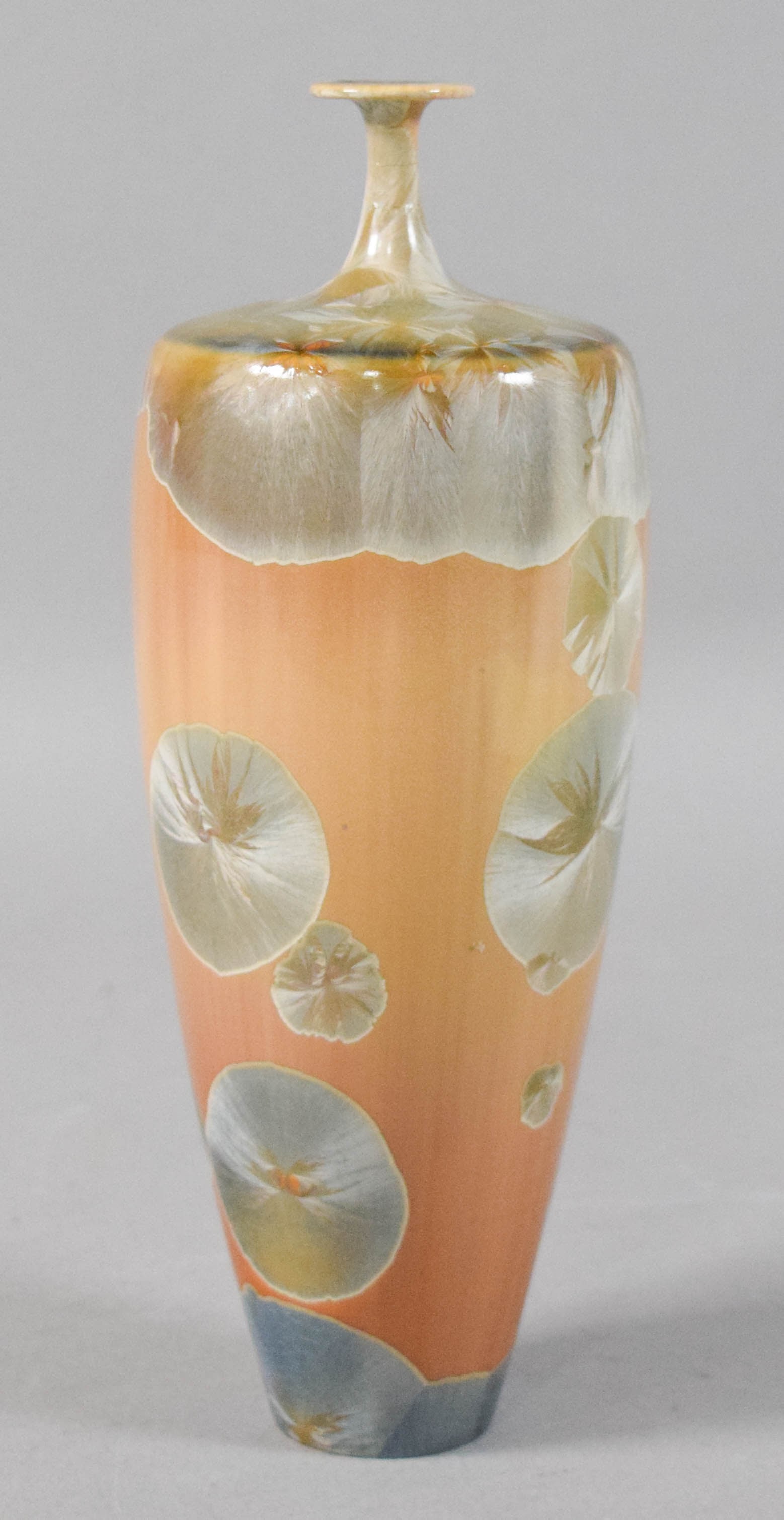 Robert Bennett Crystalline Glaze Porcelain Vase: Robert Bennett crystalline glaze porcelain bud vase. Signed on the underside of the base. 9 1/4" H x 2 3/4" diameter.Location 39C