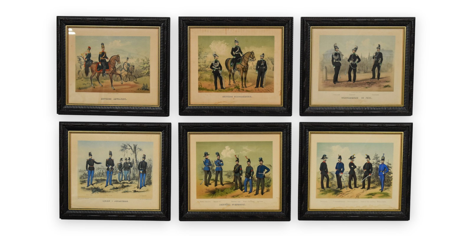 Group of 6 Hand-Colored German Military Uniform Lithographs: This set of six hand-colored lithographs features various mid-19th-century German military uniforms, primarily from the region of Leipzig. The prints depict different branches of service with titles i