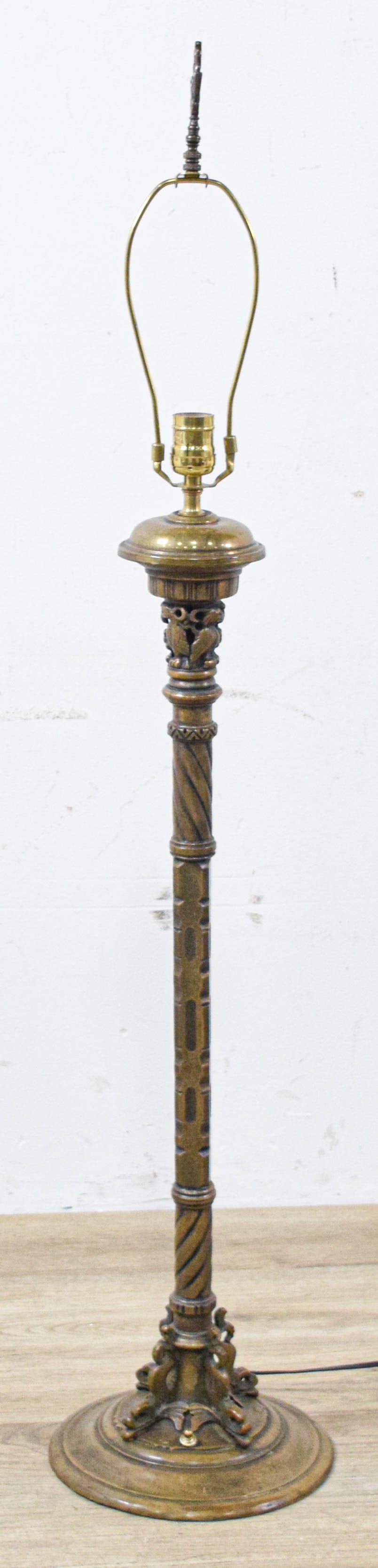 Seger Studios Cast Metal Floor Lamp with Owl and Dolphin Decoration: This cast metal floor lamp is produced by Seger Studios of New York. The item is constructed of cast metal with a dark, aged bronze-toned patina. The decorative program features a circular tiered base