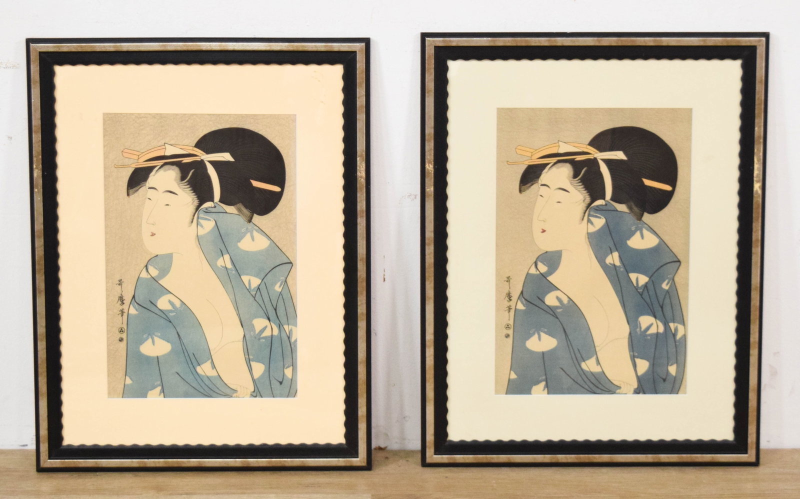 Pair of Japanese Woodblock Prints After Kitagawa Utamaro: Pair of Japanese woodblock prints after Kitagawa Utamaro. Mid-20th Century Showa-era reproductions of an 18th Century design. The left side of each print features a vertical signature reading Utamaro 