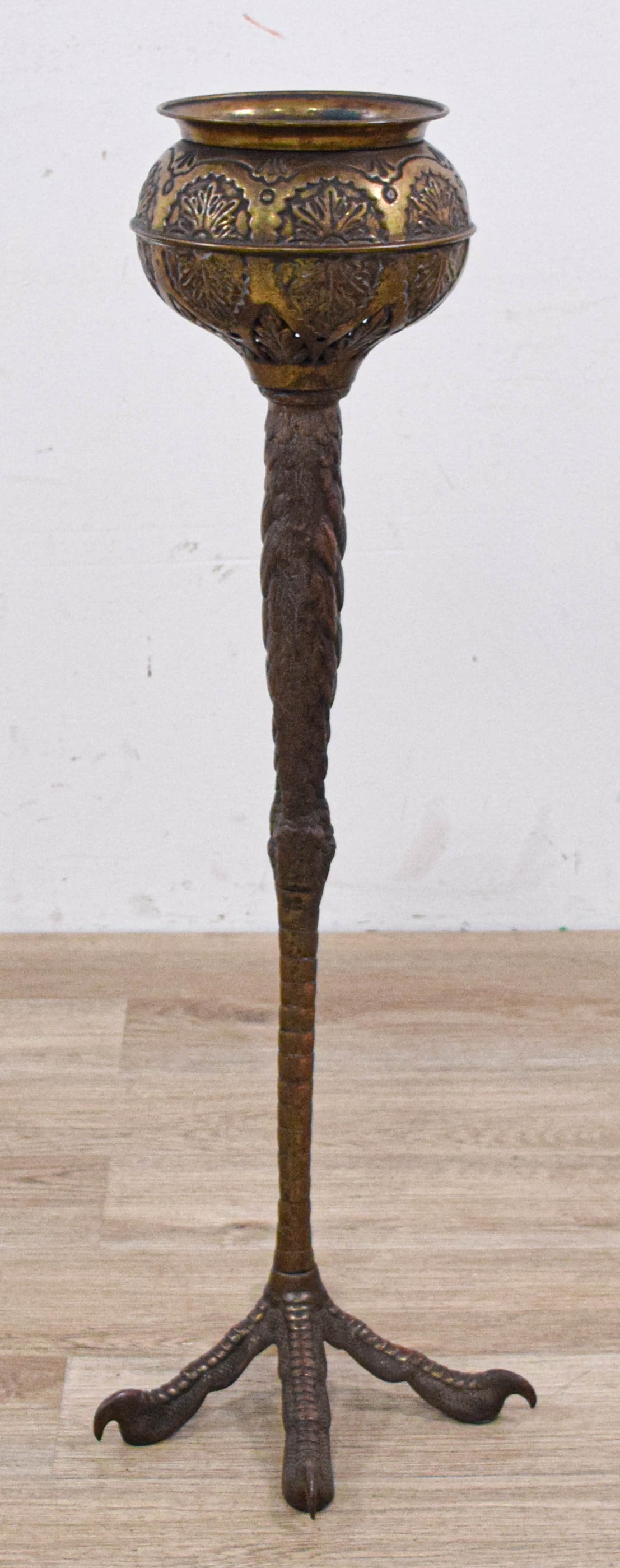 A Cast Bronze Figural Turkey Leg Jardiniere: Floor-standing turkey leg lamp base fitted as a jardiniere. Constructed from cast bronze and copper-alloy metal with a detailed base in the form of a three-toed bird talon with a rear spur, transition