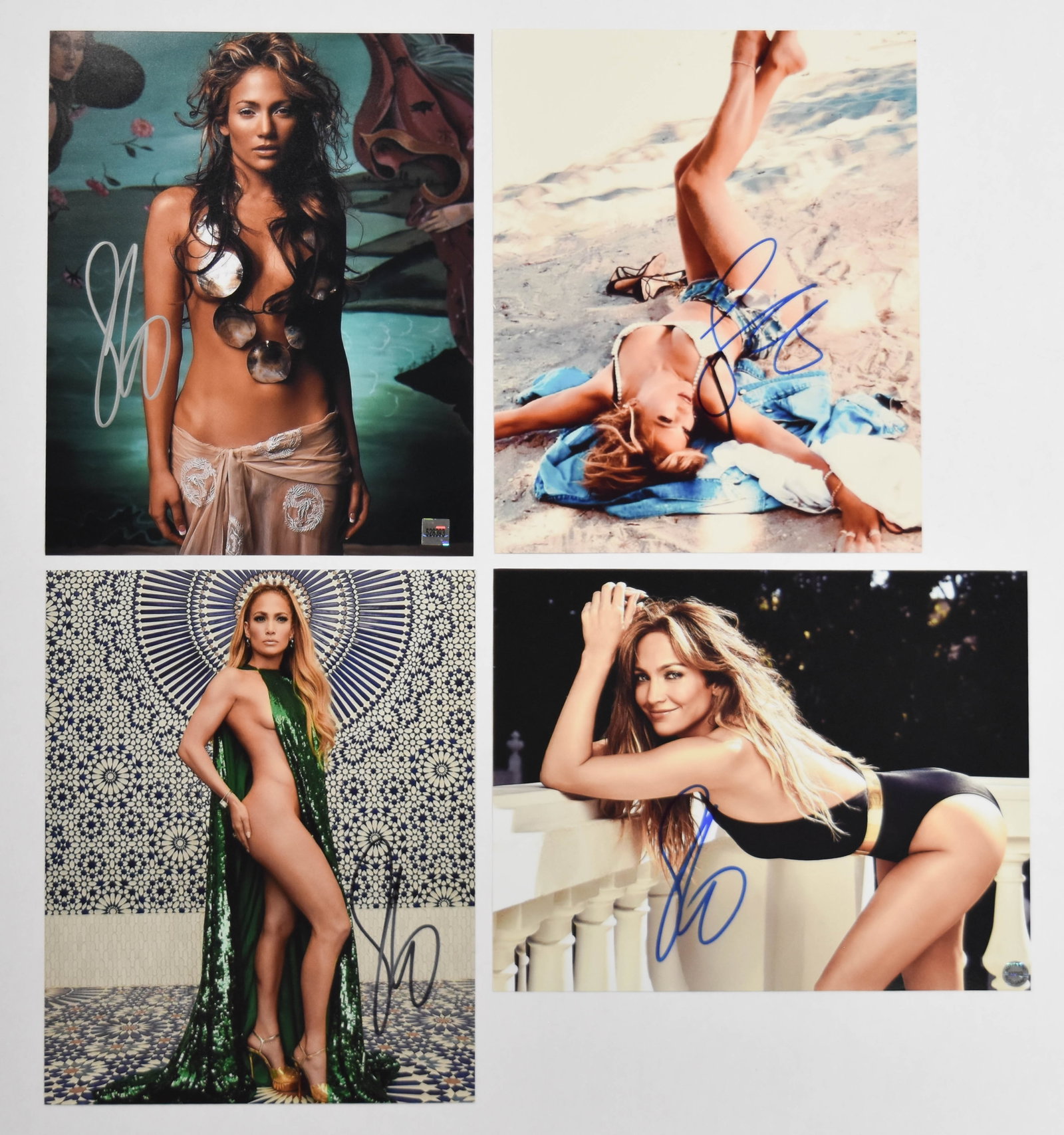 4 Jennifer Lopez Signed 8 x 10 Color Photographs: Four color photographs of entertainer Jennifer Lopez, each hand-signed and accompanied by individual authentication documentation. The set includes a color satin-finish photograph of the subject lying
