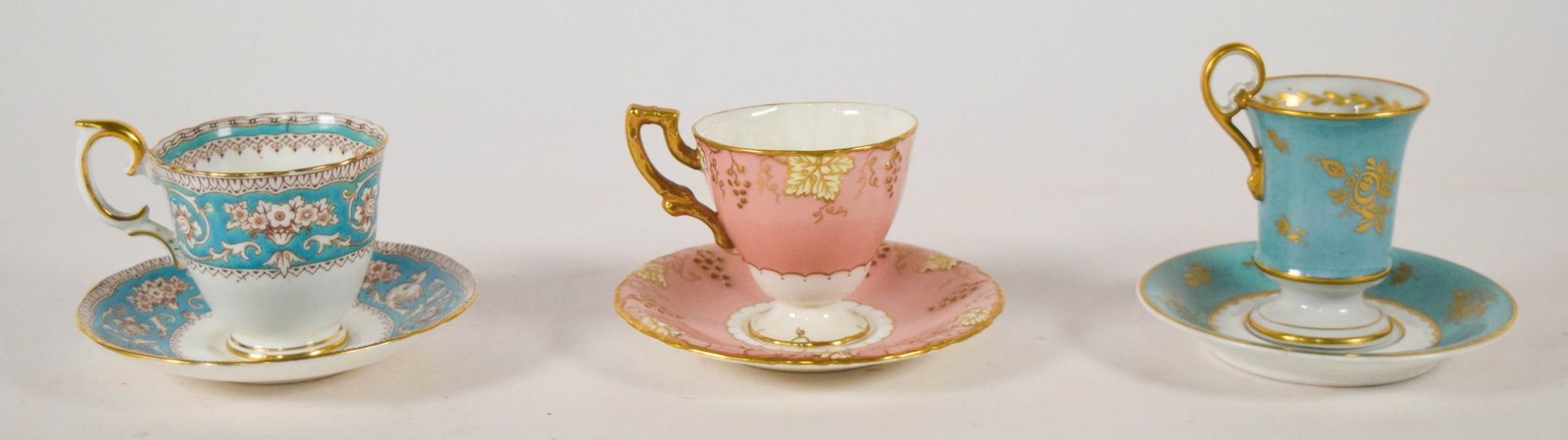 Group of 3 Crown Staffordshire, Royal Crown Derby, and Sevres Style Porcelain Cup and Saucer Sets: Group of three Crown Staffordshire, Royal Crown Derby, and French Sevres style porcelain cup and saucer sets. The Crown Staffordshire set is decorated in the Ellesmere pattern with stylized white swan