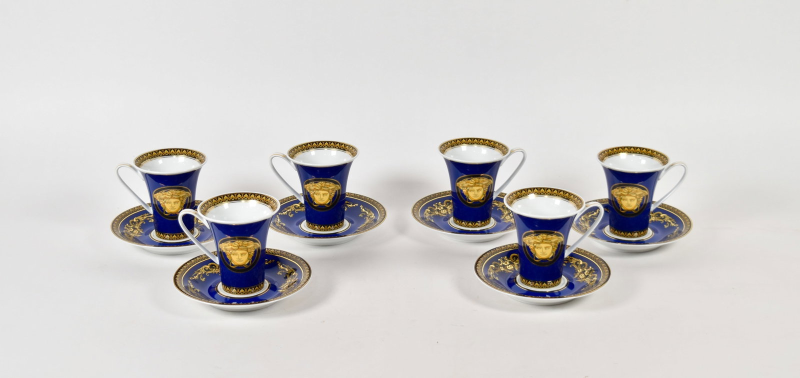 Set of 6 Versace Rosenthal Porcelain Medusa Blue Tea Cups and Saucers: Set of six Versace for Rosenthal porcelain tea cups and saucers in the Medusa Blue pattern. Each piece marked on the underside. Teacups: 3 1/2" H. Saucers: 5 3/4" diameter. Location: 18D