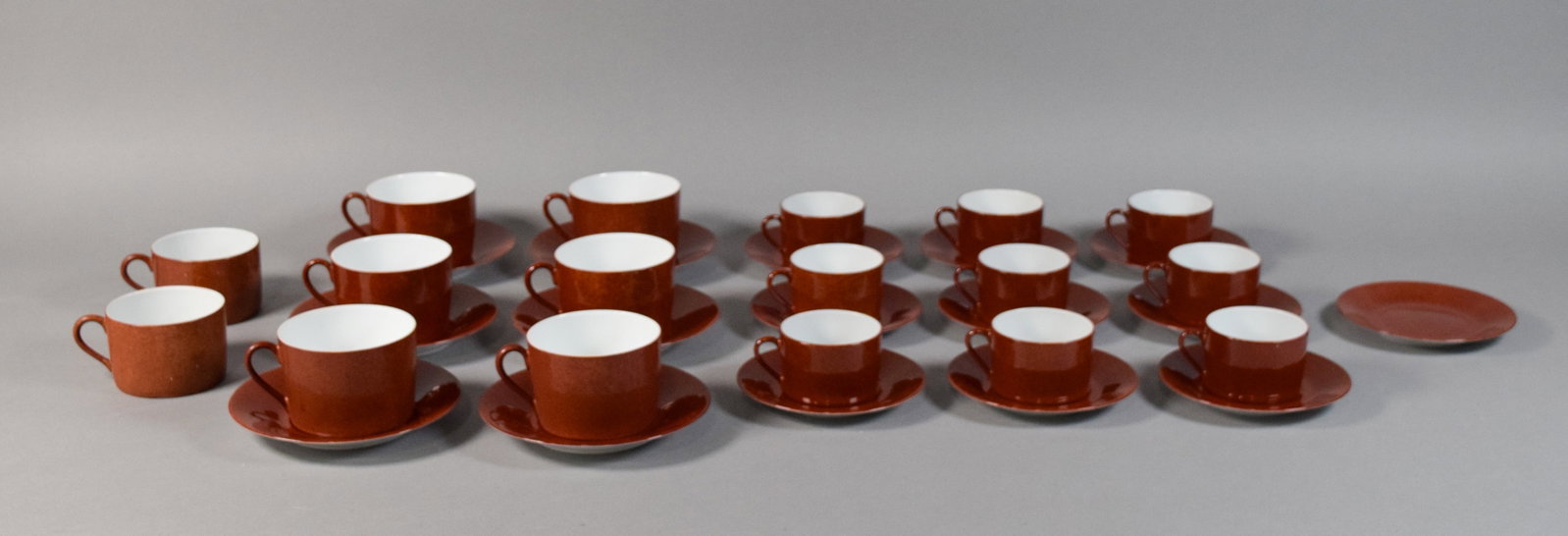 33 Pieces Laure Japy Limoges Les Mouchet?s Teacups and Saucers: Group of 33 porcelain teacups and saucers in the Les Mouchet?s pattern by Laure Japy for Limoges. Includes three distinct sizes of handled cups with coordinating saucers, plus one additional saucer. M