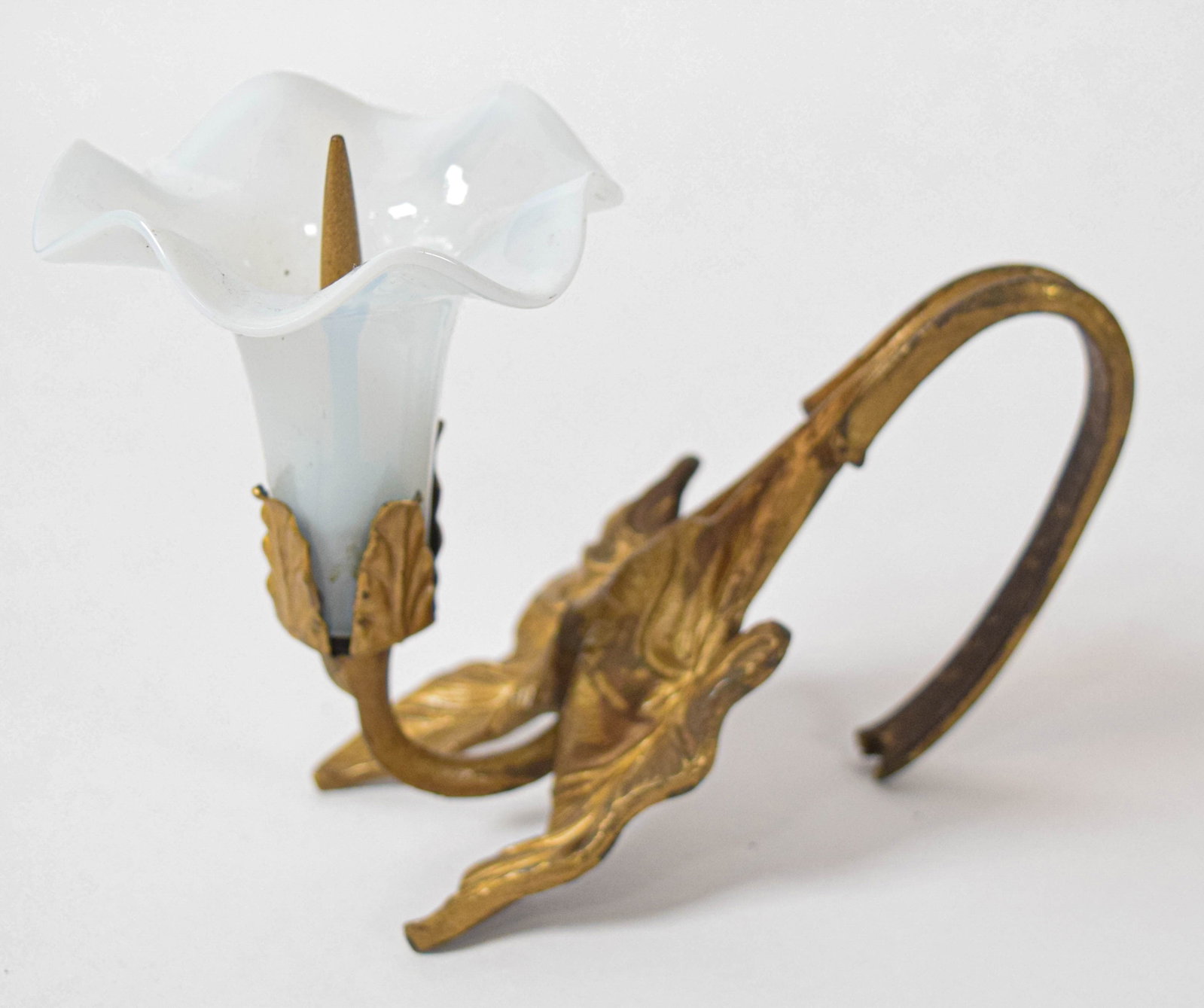 Group of 5 Art Nouveau Gilt Metal and Opalescent Glass Pricket Candle Sconces: Group of five Art Nouveau wall-mounted pricket candle sconces. Every sconce supports a single tulip-shaped shade made of translucent white opalescent glass with a ruffled rim. The design includes a ce