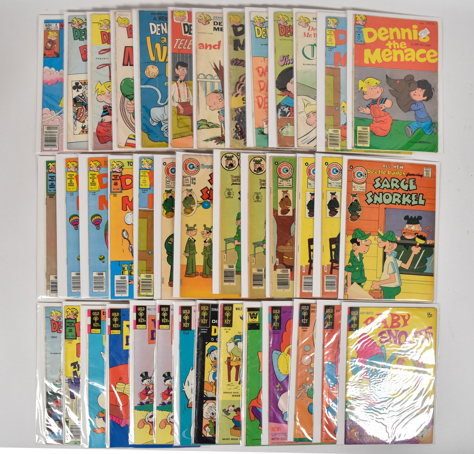 40 Fawcett Gold Key and Charlton Comic Books Featuring Dennis the Menace and Disney: 40 vintage softcover comic books from the Bronze and Silver Age featuring cartoon characters by Hank Ketcham (American, 1920-2001) and Walt Disney (American, 1901-1966). The collection consists of iss
