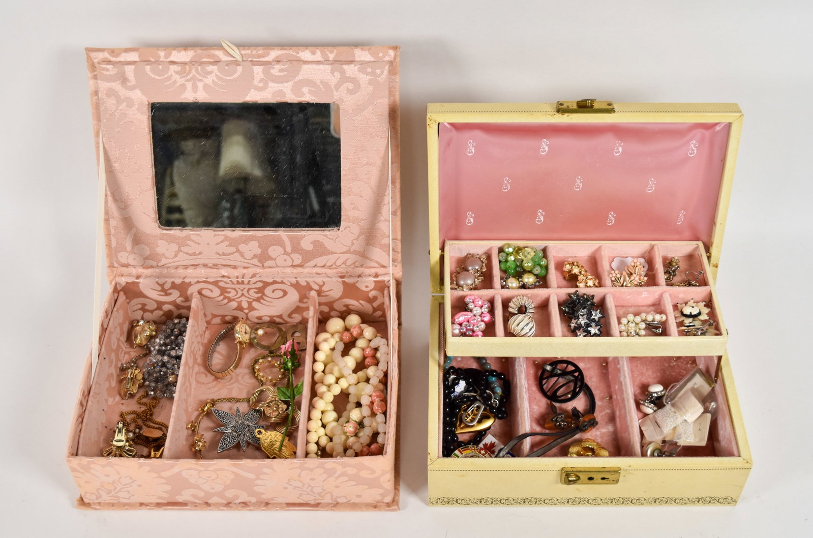 2 Mid-Century Jewelry Boxes and Assorted Costume Jewelry: Two jewelry boxes containing a collection of mid-20th-century costume jewelry. The group includes a variety of necklaces, earrings, brooches, and pins dating primarily from the 1950s through the 1970s