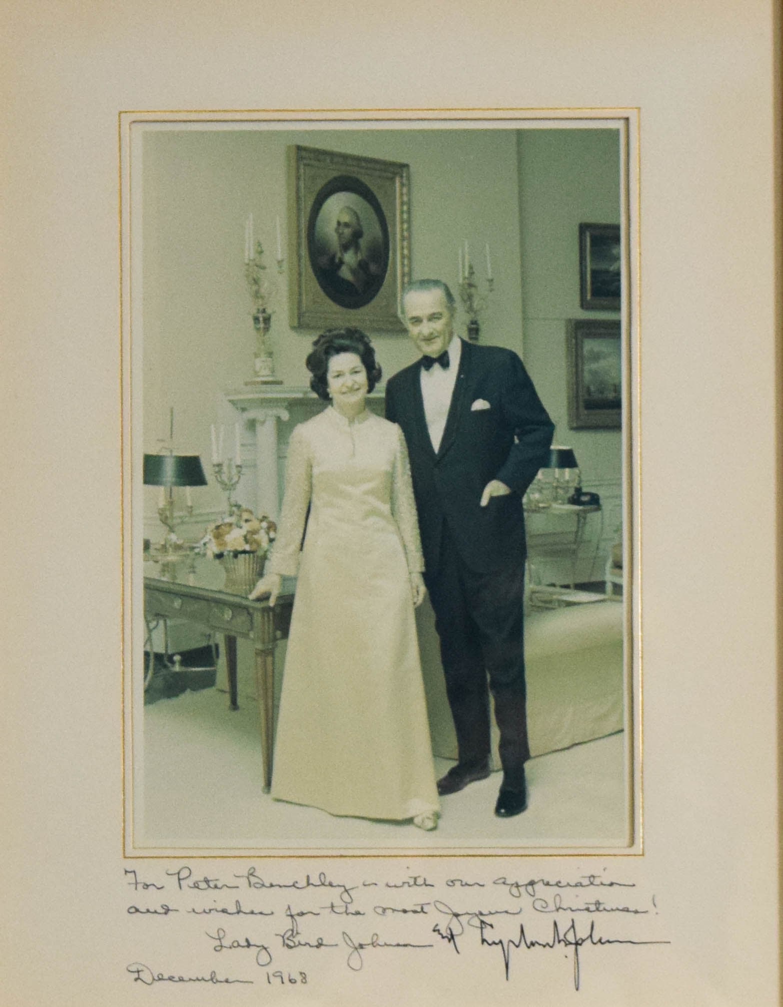 Lyndon B. Johnson and Lady Bird Johnson Signed Photograph, Inscribed to Peter Benchley: Lyndon B. Johnson (American, 1908-1973) and Lady Bird Johnson (American, 1912-2007). Inscribed and signed color photograph. The formal portrait shows the President and First Lady standing in a White H