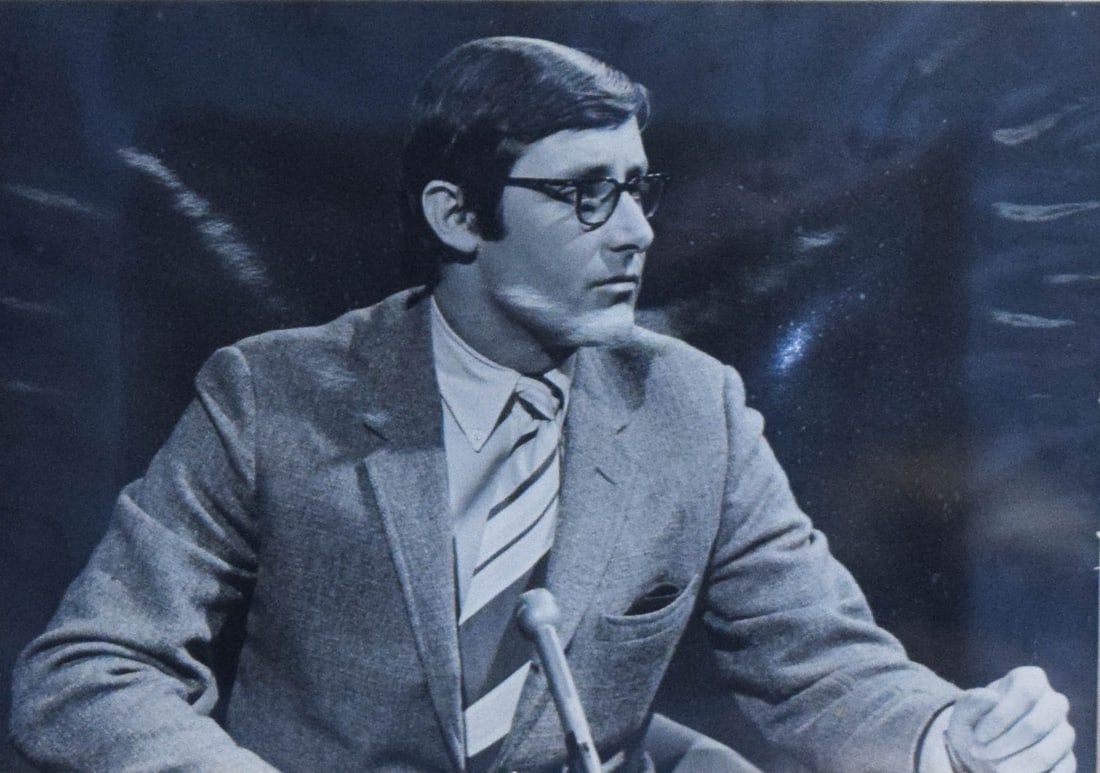 Silver Gelatin Print Peter Benchley In Television Studio: Peter Benchley (American, 1940-2006). Silver gelatin print, publicity portrait of the author in a television studio setting. Unsigned. Frame: 8 1/8" H x 9 7/8" W x 1/2" D. From the personal collection