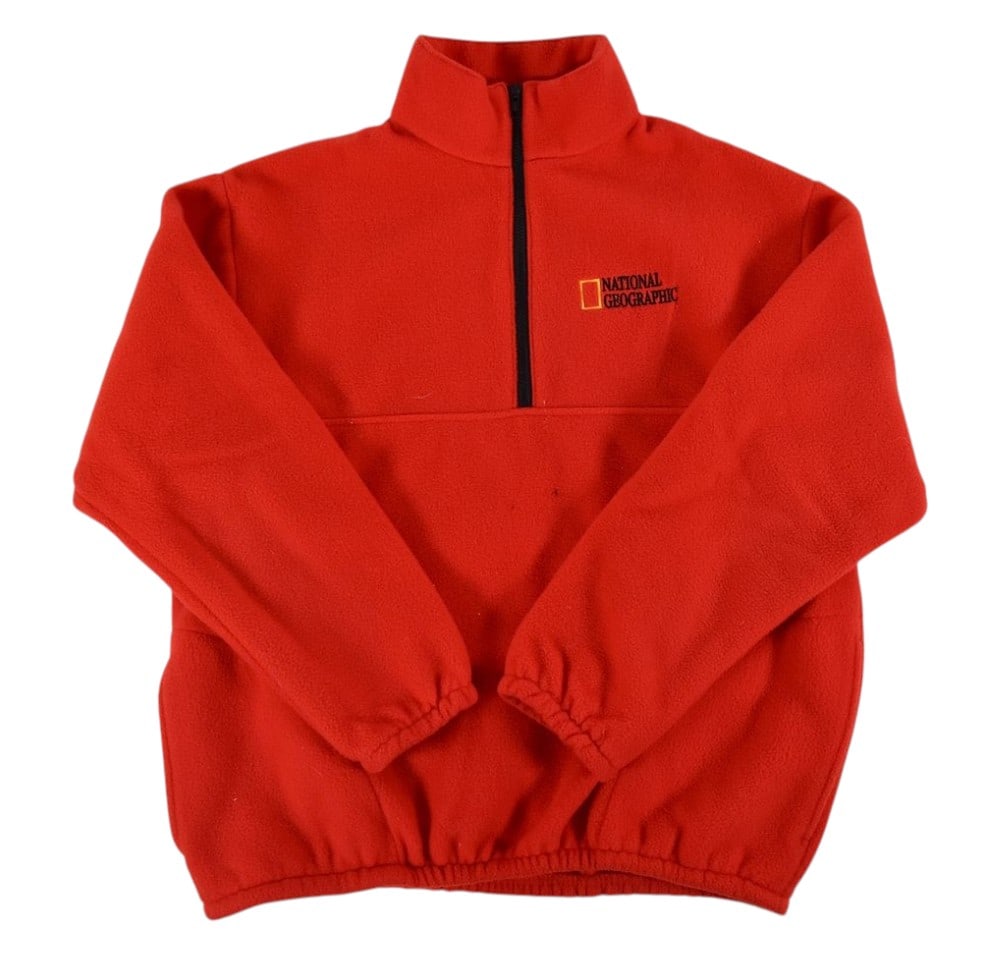 Peter Benchley's National Geographic Fleece Quarter Zip: Auburn Sportswear polyester fleece pullover from the personal collection of Peter Benchley. The garment is constructed of bright red synthetic fleece featuring a stand-up collar and a black quarter-le