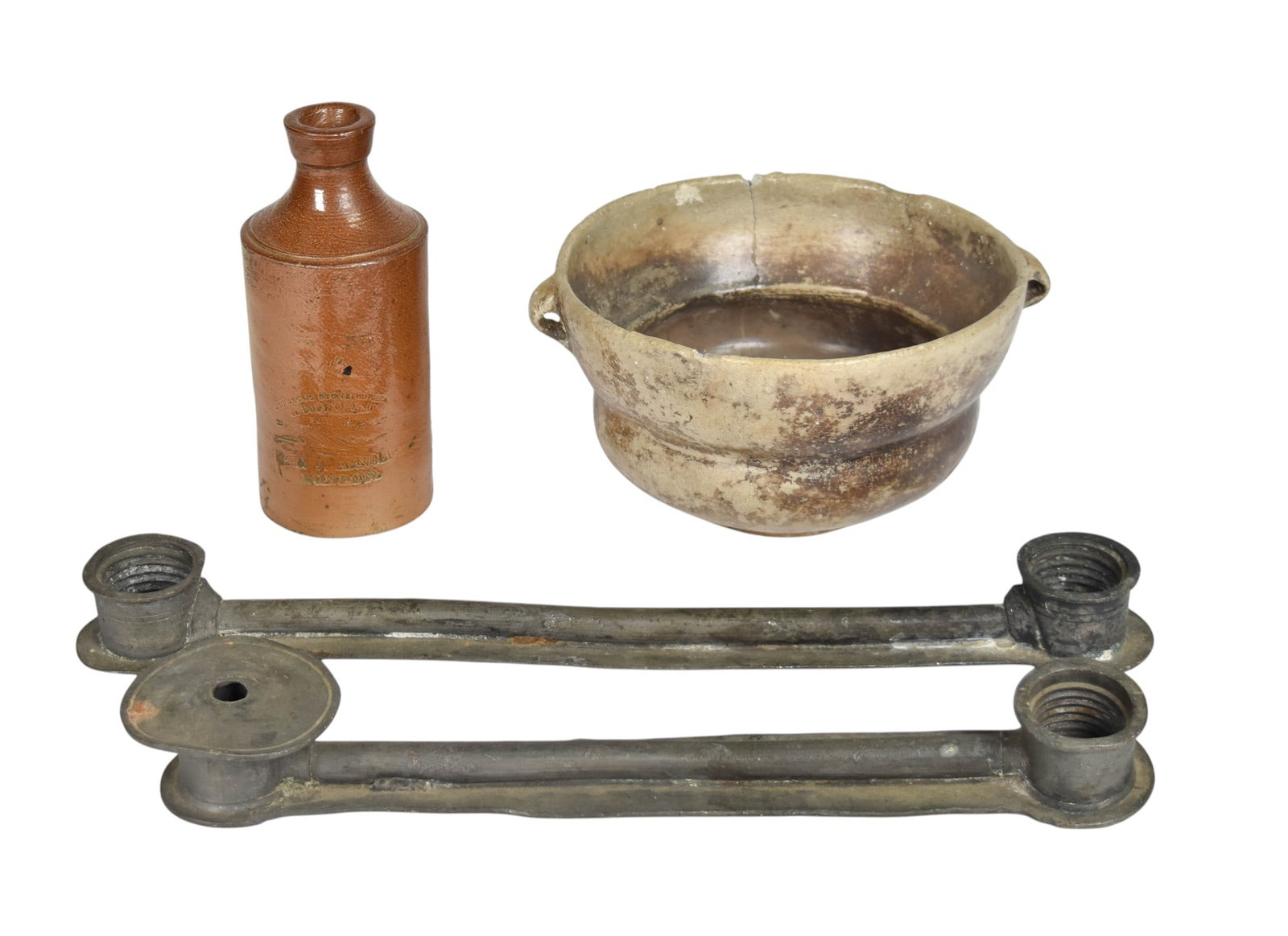 4 Assorted Artifacts Including Denby Stoneware Ink Bottle and Ceramic Bowl: Assortment of four historical artifacts comprising a stoneware bottle, a twin-handled ceramic bowl, and two lead alloy components. The salt-glazed stoneware utility bottle features a cylindrical body 