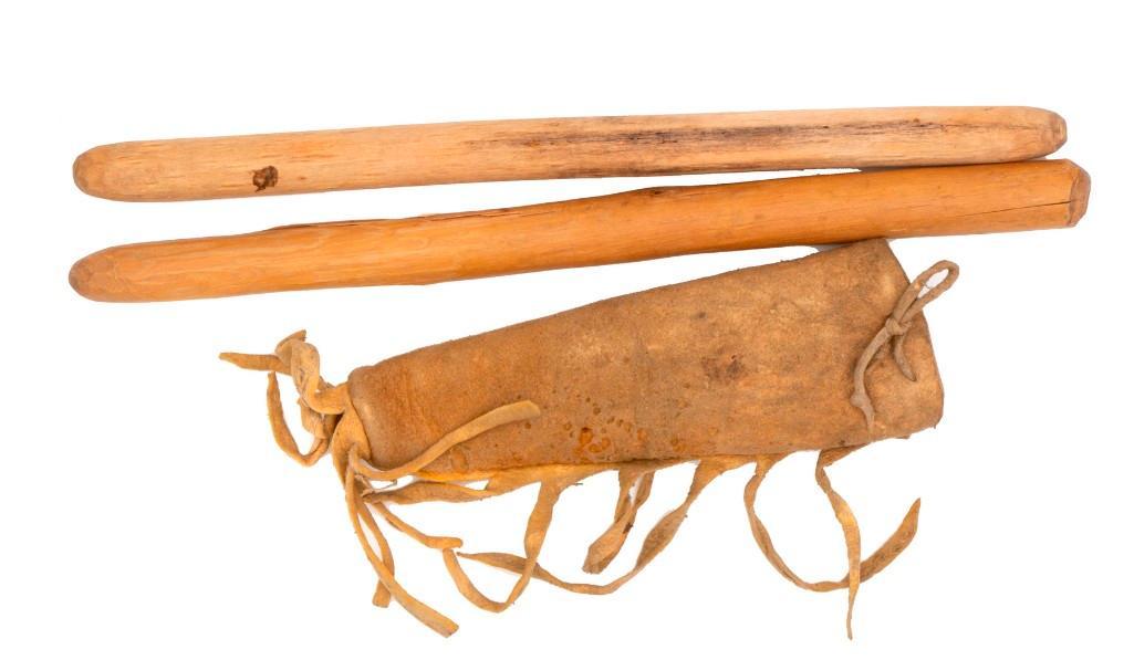 Hide Bag with Dowels: 6" x 2.25". Hide construction with fringe. Holds two 11" tapered wooden sticks, possibly roach formers.