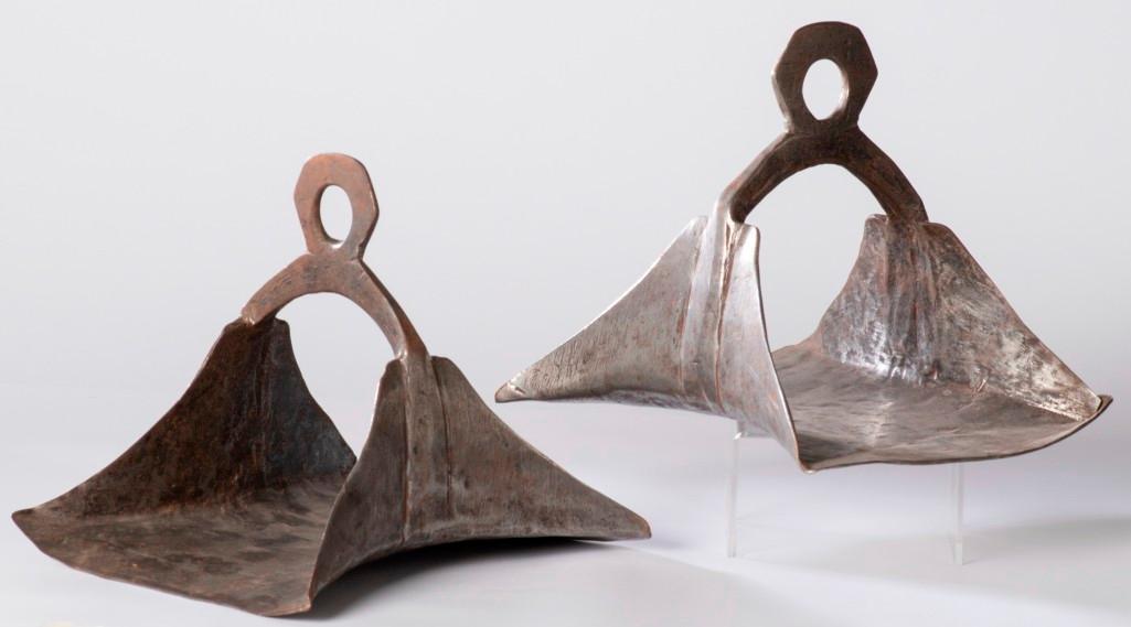 Pair Of Early Argentinian Stirrups: Made of hammered metal with silver on the outer edges. **Overall very good condition.** $200-$400