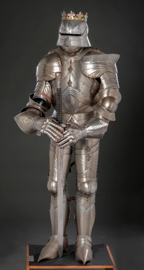 A Quality 20th Century Cap a Pied Suit of Gothic Armor: Reprising a Mid 15th Century Original. A lovely suit of excellent form with visored sallet, fluted Gothic form breastplate, well formed greaves and cuisses. This is a well made completely articulated 