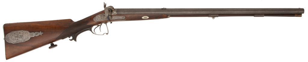 Fine Percussion Cape Gun by Anton Vincent Lebeda, Prague: .65 bore diameter, 27.25" barrels, S/N 3127. Barrels of fine crolle-type Damascus steel with one barrel straight rifled, and the other twist. Inset German silver front sight with fire-blued foldin