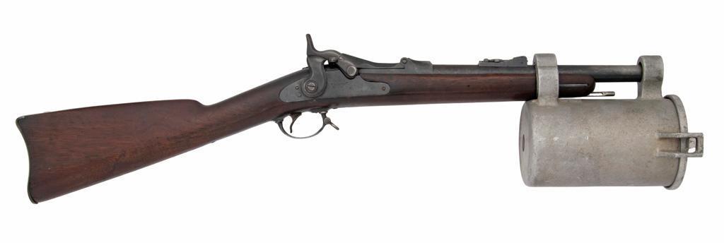U.S. Model 1873 Springfield Trapdoor Naval Line Throwing Rifle: .45-70 caliber, 13" barrel length, S/N 5138. Rifle converted to a line throwing rifle by Naval Company of Doylestown, PA. No case, still has the container on the end of the rifle. **Overall very g
