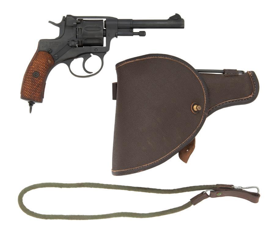 **Tula Soviet Russian Model 1895 Nagant Revolver: 7.62X38mmR caliber, 4.5" barrel, S/N ÐŸÐœ117. Factory reblued finish with checkered wood grips. Seven-shot cylinder. Frame marked with Tula arrow and 1938 production date. Includes holster. **