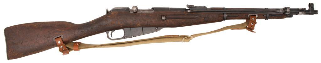 **Chinese Type 53 Carbine: 7.62x54mmR caliber, 20" barrel, S/N 1007180. Stock and receiver match. Blued finish with solid wood stock. Hooded post front sight with tangent rear sight. Receiver marked with factory code, seria