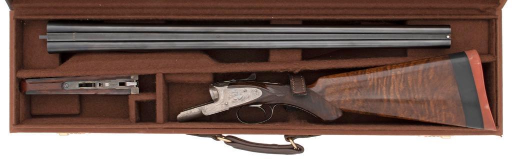 **Cased L.C. Smith Grade 3 SIdelock Side by Side Shotgun: 12 gauge, 28" barrels, S/N 205297 (ca. 1944-45). Length of pull 15" to buttpad, drop at heel 3.75", ejector type. Reblued barrels with checkered walnut stock and checkered splinter forend with banjo-t