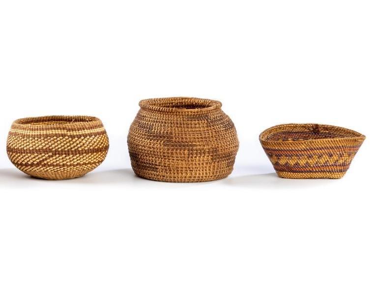 Three Native American Miniature Baskets: Largest measures 3.75" x 3.75". Groups represented include Pima and Makah. **Some minor wear to weaving.** $200-$300