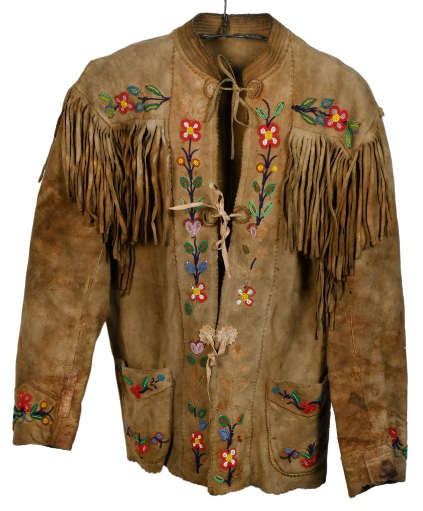 Beaded Hide Jacket: Leather construction with fringe on shoulders, back, and sleeves. Beaded on cuffs, shoulders, and front seams with red, green, blue, white, and yellow flowers and other floral motifs. Early-mid 20th c