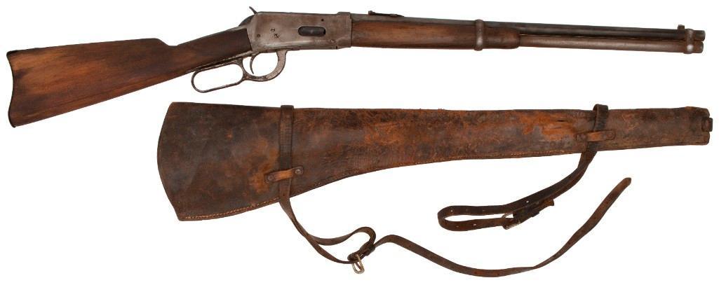 **Winchester Model 94 Saddle Ring Carbine Attributed to Bill Picket: .30-30 caliber, 20" barrel, S/N 625749 (ca. 1914). Repainted steel finish with sanded wood stock. Includes leather carbine scabbard. Attributed to Bill Pickett while a performer at the Miller Brothers