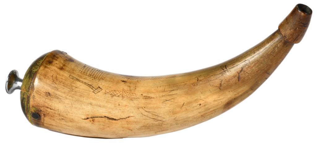 Carved American Powder Horn: 8.5" x 2.5". Wood plug with added steel button. Carved with snakes, an axe, a musket, and what appears to be a log cabin and pistol. **Good condition overall. Some darkening and scratching with only m
