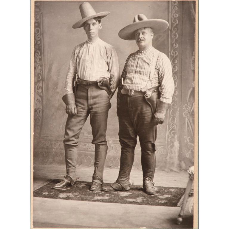 Cabinet Card of Two Armed Men: 5.5" x 4", mounted to 10" x 8" card stamped "Redford". Depicts two men armed with revolvers and bowie knives. Possibly a staged souvenir photo. **Good condition overall. Some wear to corners and edges