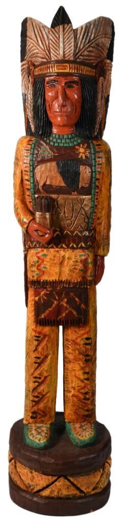 A Large Carved Cigar Store Indian by Frank Gallagher: American, 20th century. A hand carved and painted cigar store Indian by Frank Gallagher of the Gallagher family. Frank is third generation carver to his family name, signed on back of carving; ht. 72"