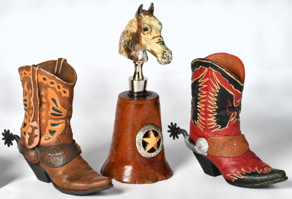 A Bronze Horse Bust Wine Stopper plus Cowboy Boot Door Stops: American, 20th century. A bronze equestrian horse bust wine stopper, hallmark of a hand and marked C.C., rising on a shaped wooden stand with Texas ranger button; ht. 8, dia. 3 inches. Two painted cow