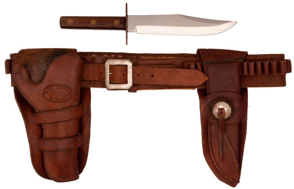 Single Action Army Revolver Gun Belt of Texas Ranger Jay Banks: 46.25" x 2.25". Folded and sen brown leather with integral ammunition loops. Belt shows maker's mark of S.D. Myres of El Paso, Texas; with holster showing the mark of El Paso Saddlery. Includes Parker