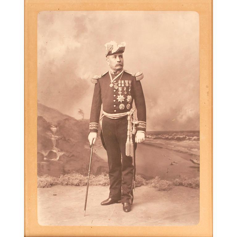 Large Format Photograph of Don Porfirio Diaz: Mounted photograph, 15.75 x 19.5 in. overall, taken by noted Mexico City photographer Octaviano de la Mora, showing Diaz in full dress uniform. $300-500